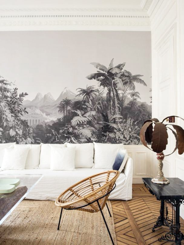 black and white tropical mural wallpaper in living room | via coco kelley