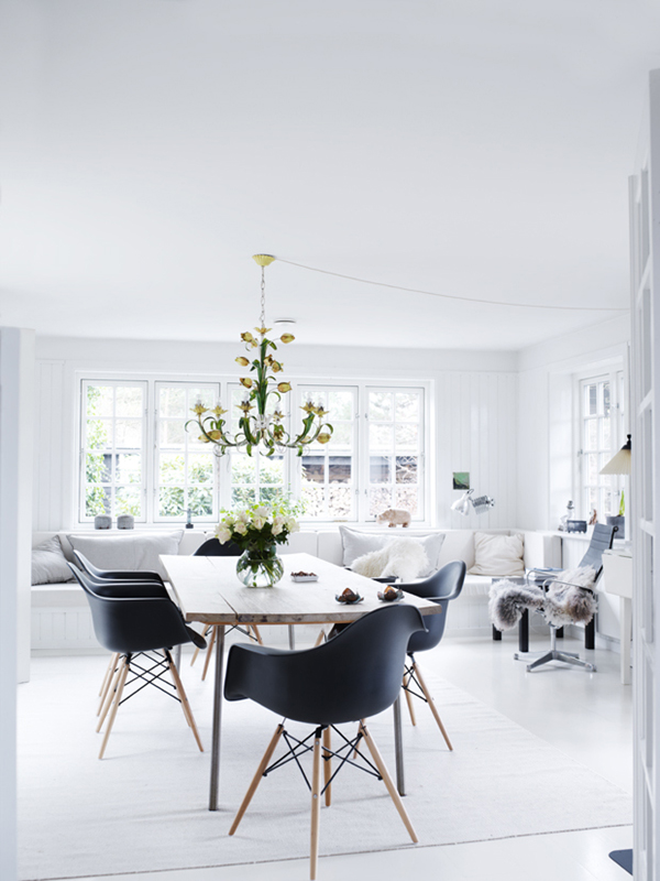 a black and white scandinavian dining room with antique chandelier | via coco+kelley