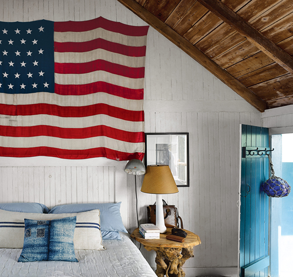 small seaside cottage bedroom + flag // captain jack's wharf