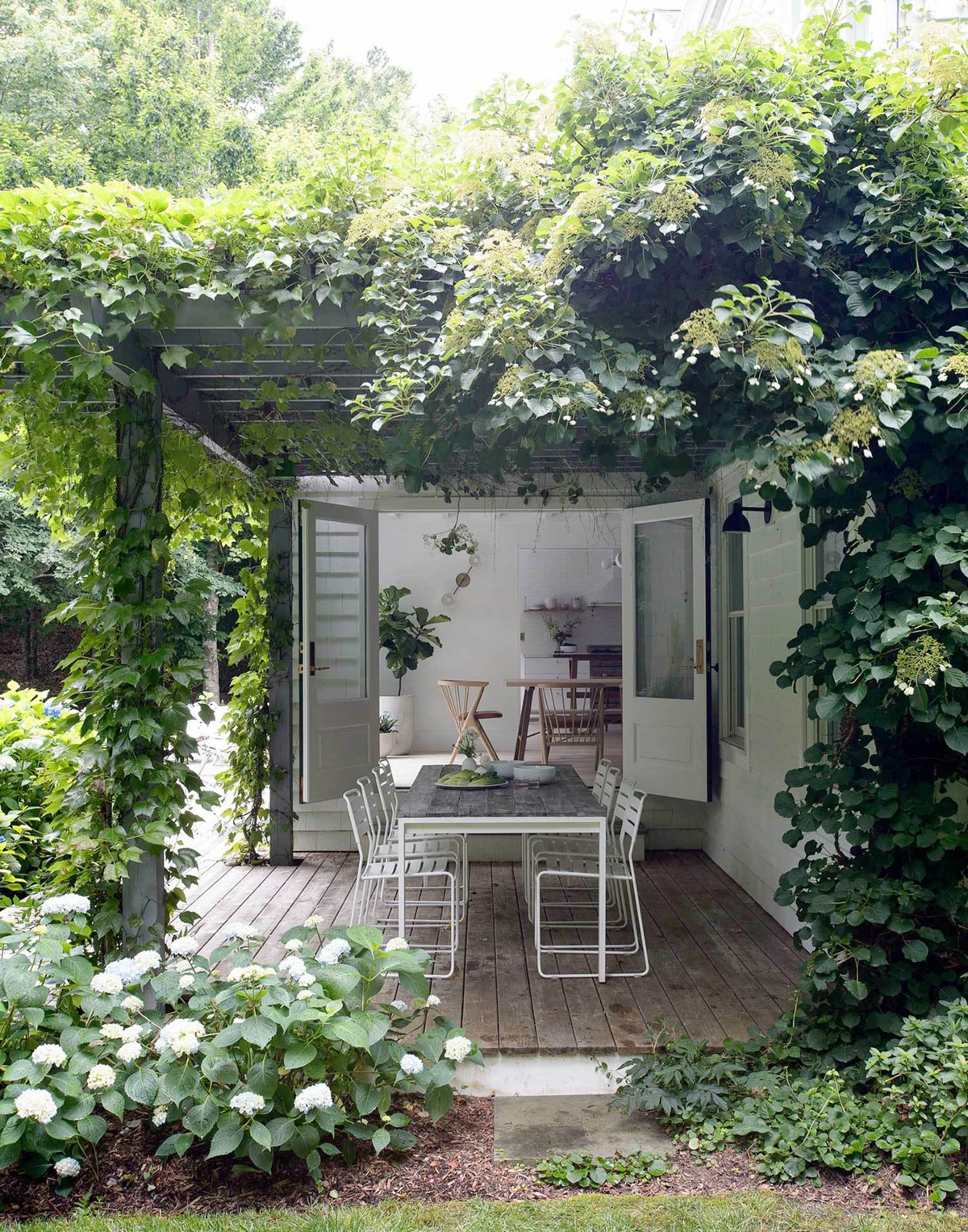 vine covered outdoor patio | amagansett house designed by Jessica Helgerson