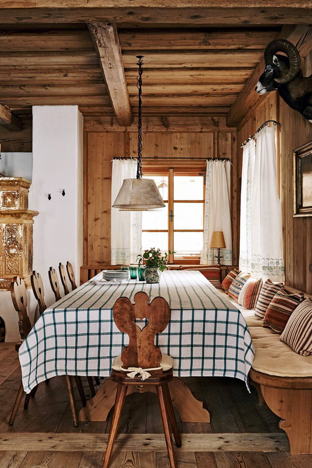 alpine house tour classic austrian chairs and checkered tablecloth