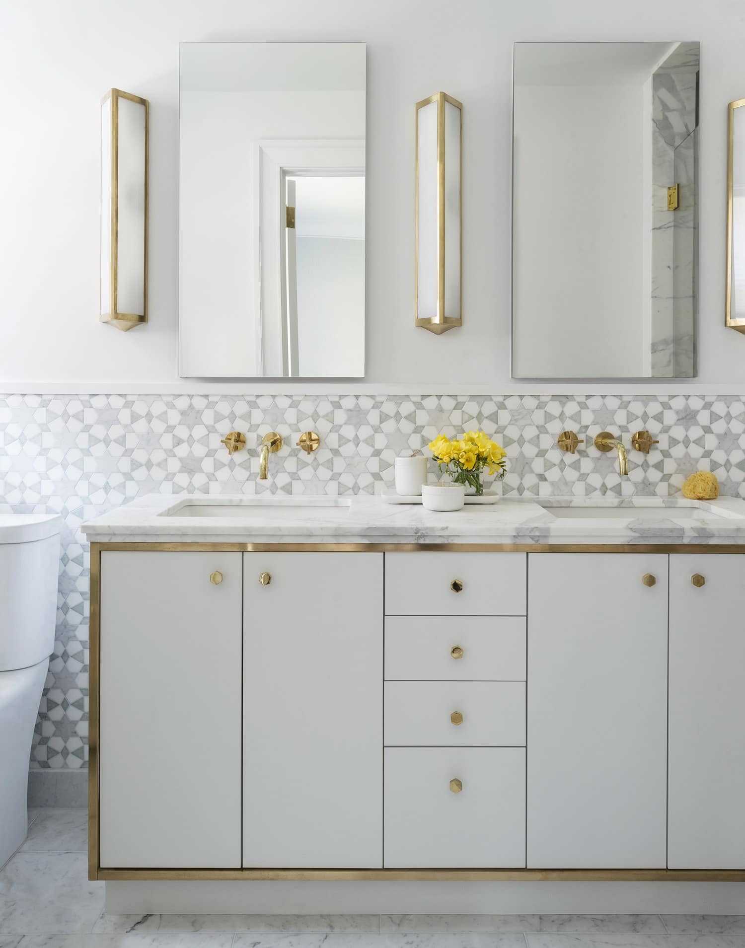 brass trim on white bathroom vanity with statement tile | studio DB park avenue house tour on coco kelley