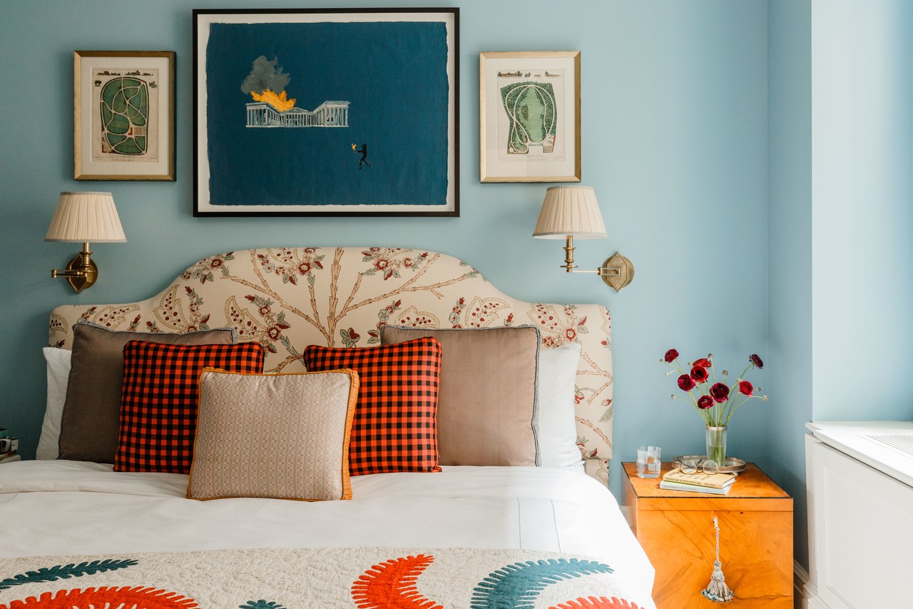 blue walls in a bedroom with orange accents | design by cece barfield