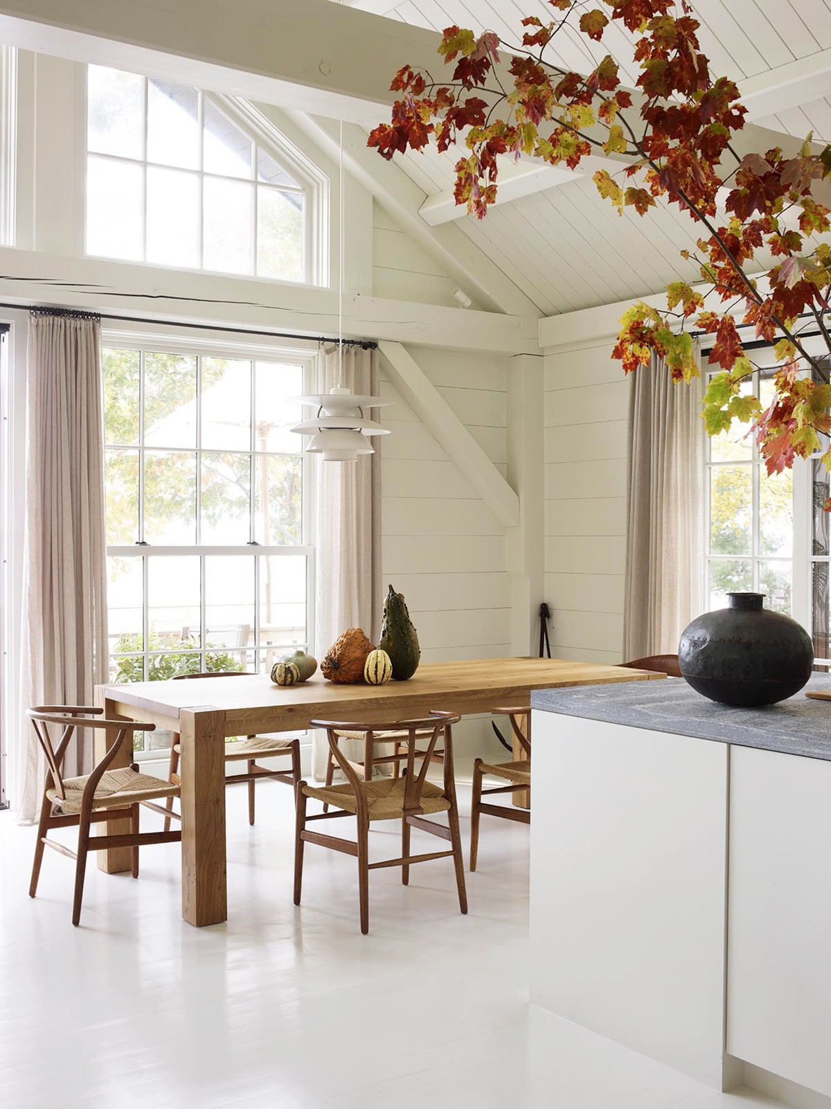 organic wood and creamy walls in a simple dining room | seaside cottage house tour on coco kelley