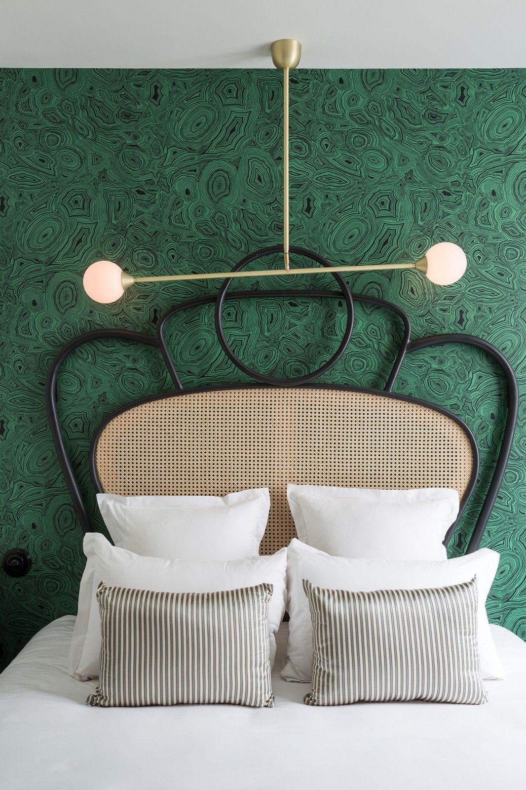 malachite wallpaper and cane bed at the hotel Panache in Paris | statement headboard roundup on coco kelley