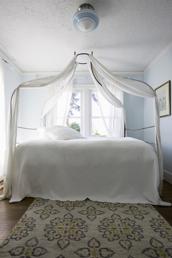 dreamy aqua bedroom with canopy bed | tiffany wendel house tour via coco+kelley