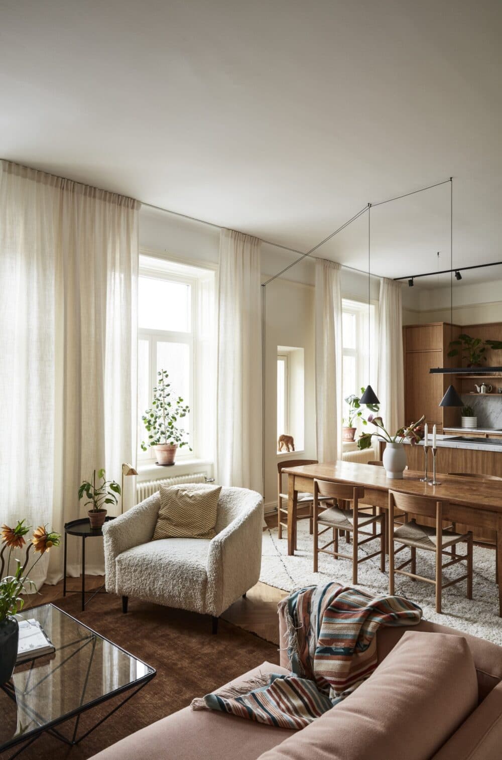 tonal decorating in an open living space apartment pink rust and wood tones