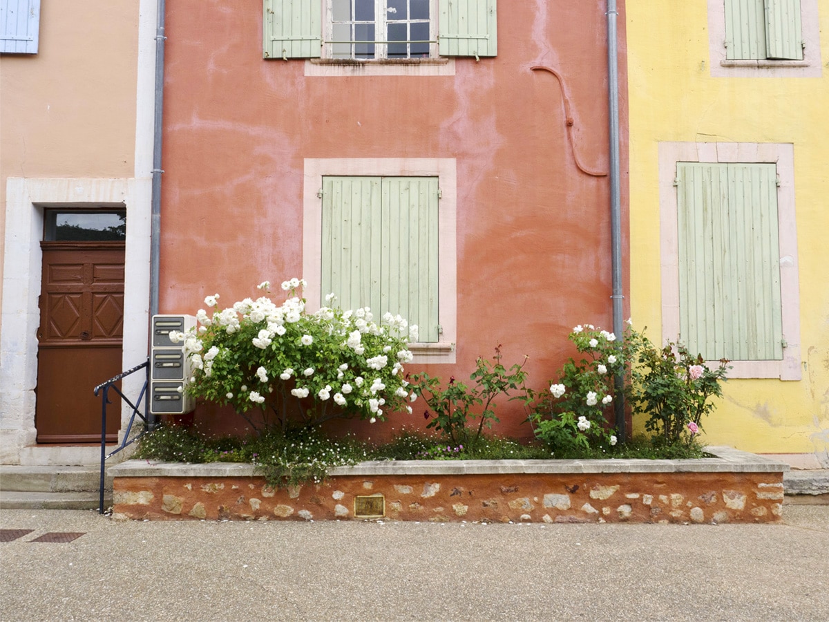 colorful facades in roussillon, france | 24 hours in provence travel guide by coco kelley