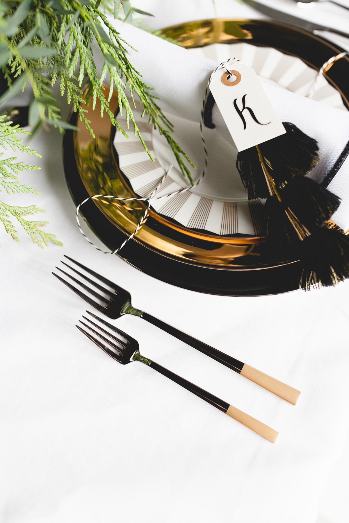 a black tie holiday tabletop setting with gold details | coco kelley