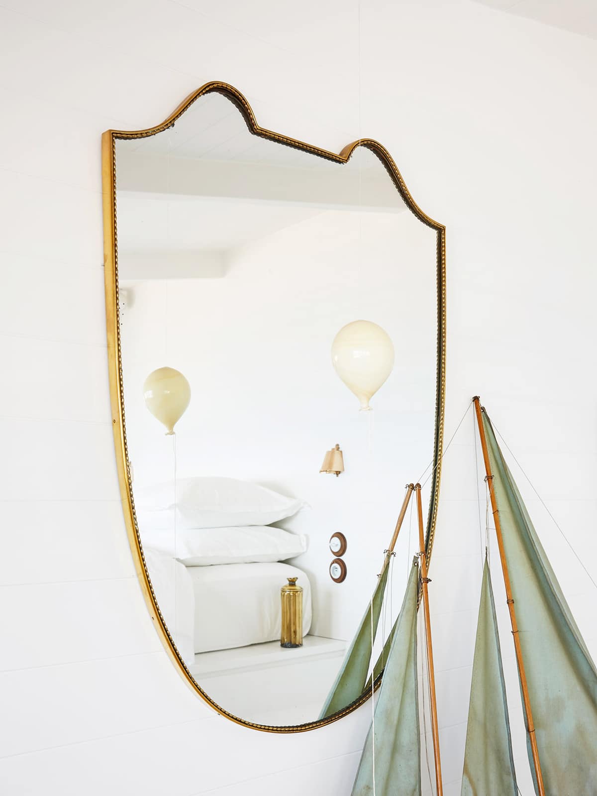 a brass mirror detail in the most chic and tiny home on the italian riviera | house tour on coco kelley