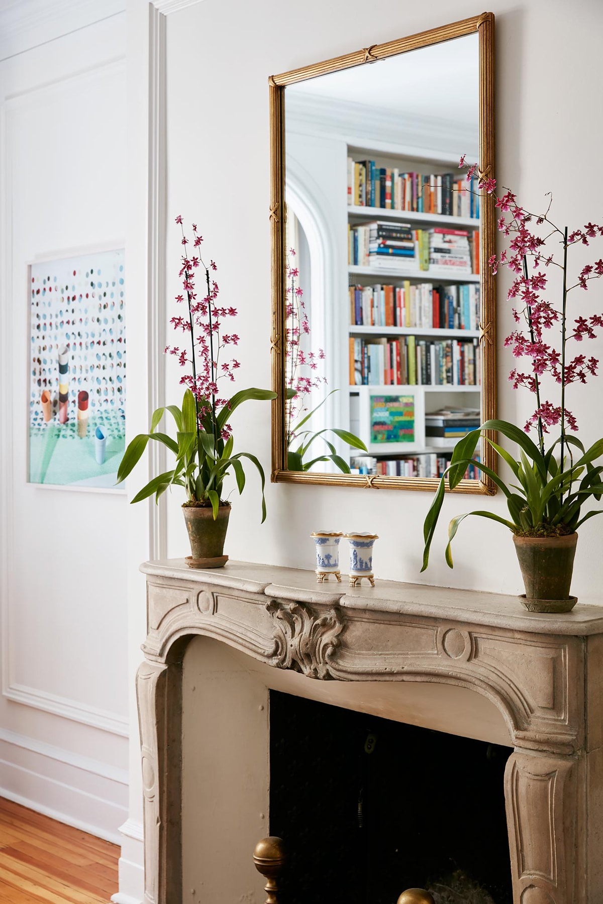 a classic mantel flanked with orchids | room of the week via coco kelley