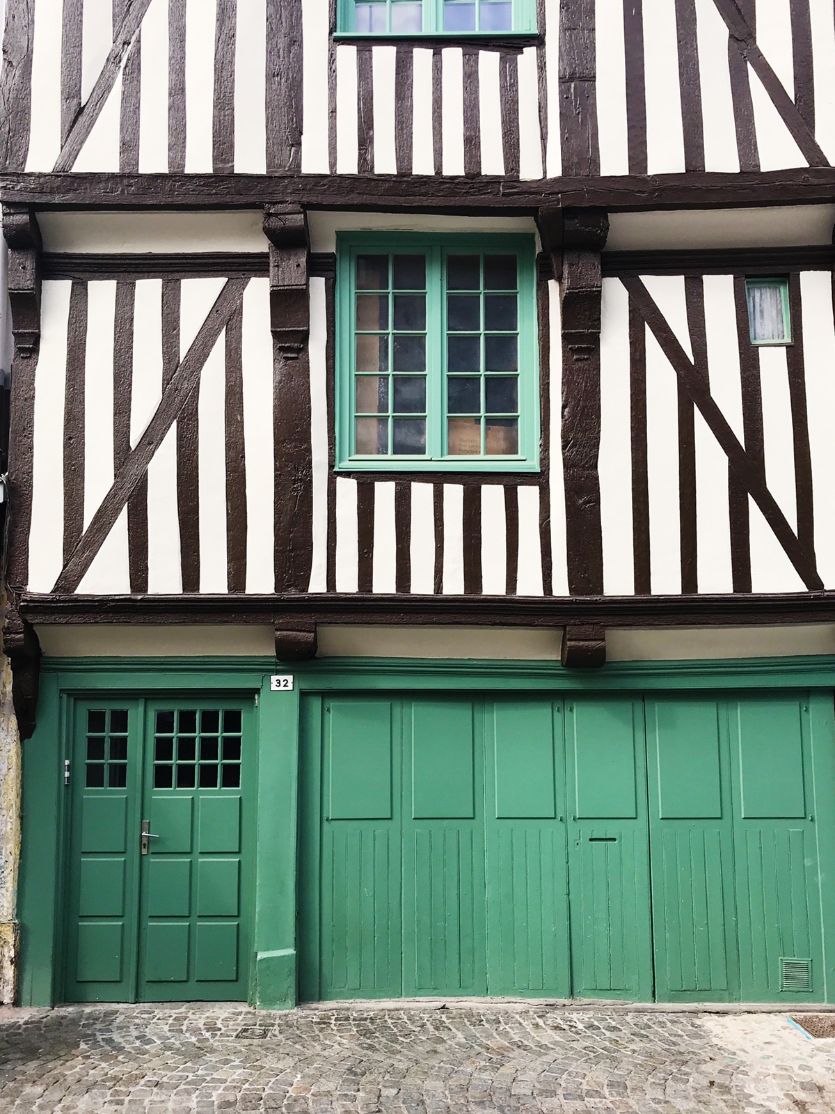 a classic Normandy facade in honfleur france | travel guide on coco kelley