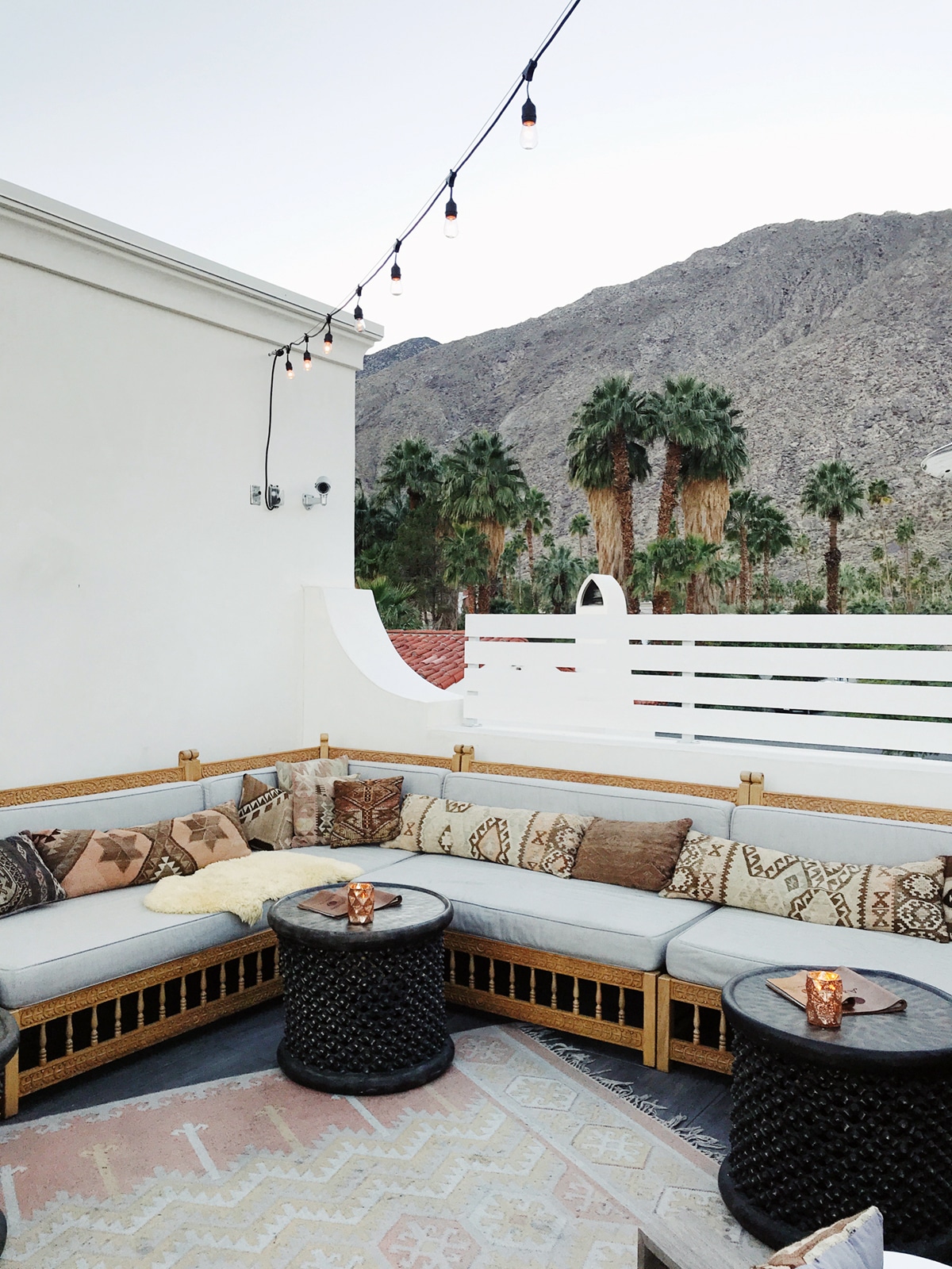 a cozy spot for a cocktail with a big bench seat | tour of la serena villas palm springs on coco kelley