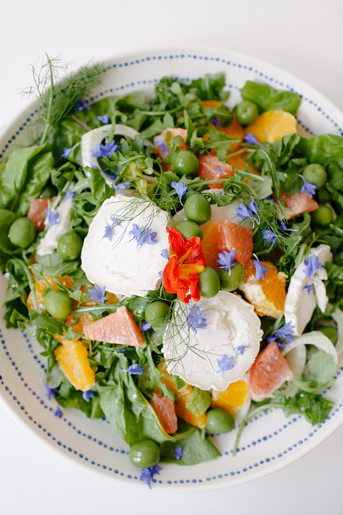 a fresh summer salad recipe with fennel, citrus, edible flowers, and more | recipe via coco kelley