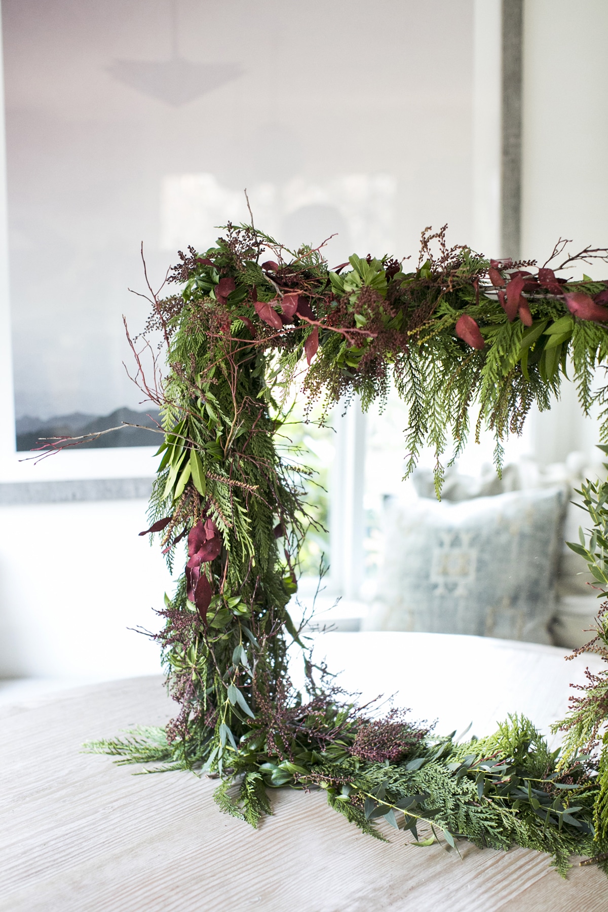 how to make this gorgeous holiday garland mirror with orchids and greenery | DIY tutorial on coco kelley