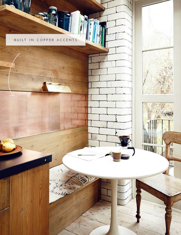 a metallic panel in a wood built in for this breakfast nook adds beautiful detail - coco kelley in the details