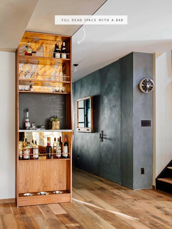 a mirrored copper backsplash makes this hallway bar a cool focal point - coco kelley in the details