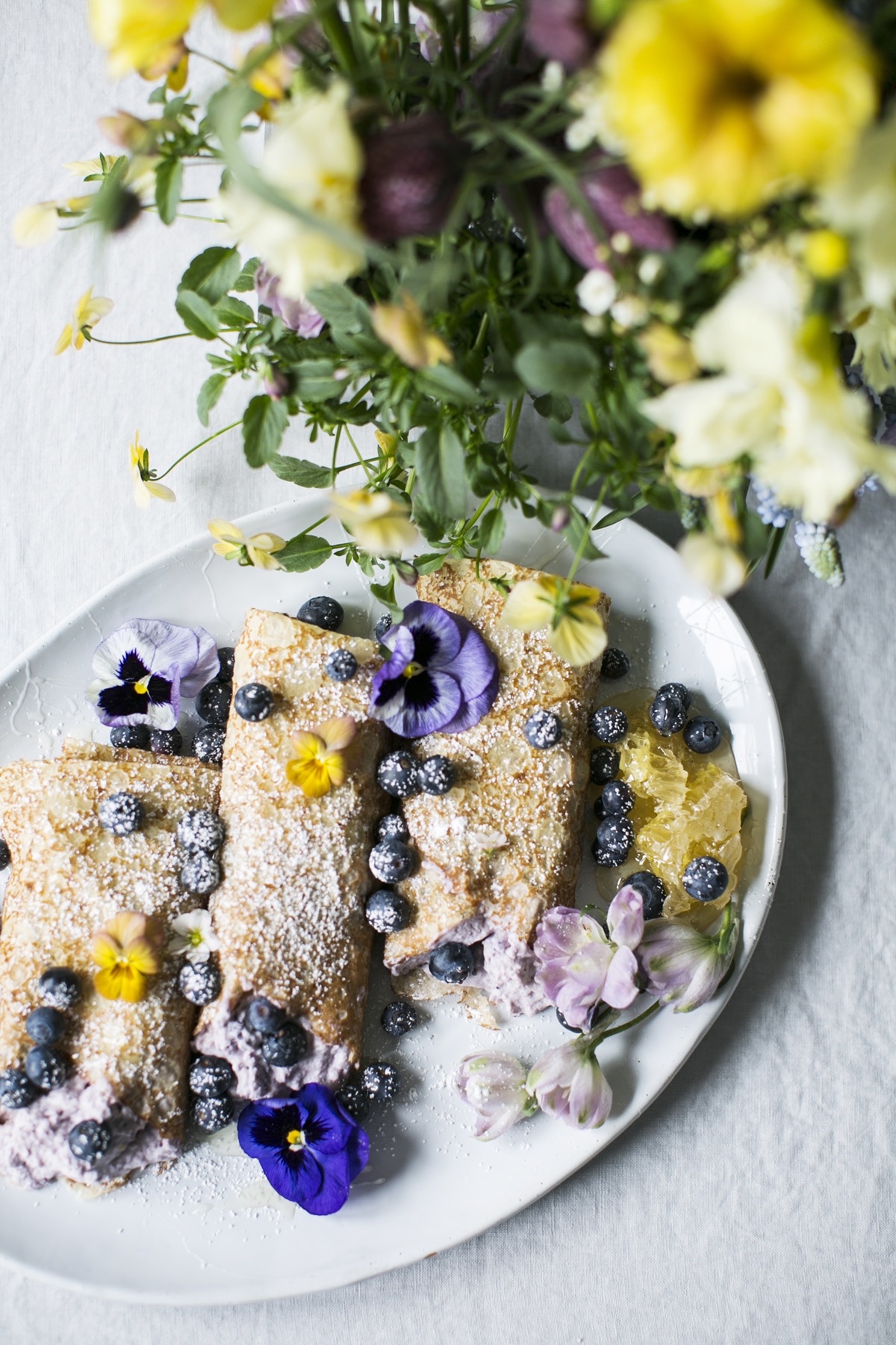 blueberry lemon ricotta crepes with edible flowers | easter brunch menu ideas on coco kelley
