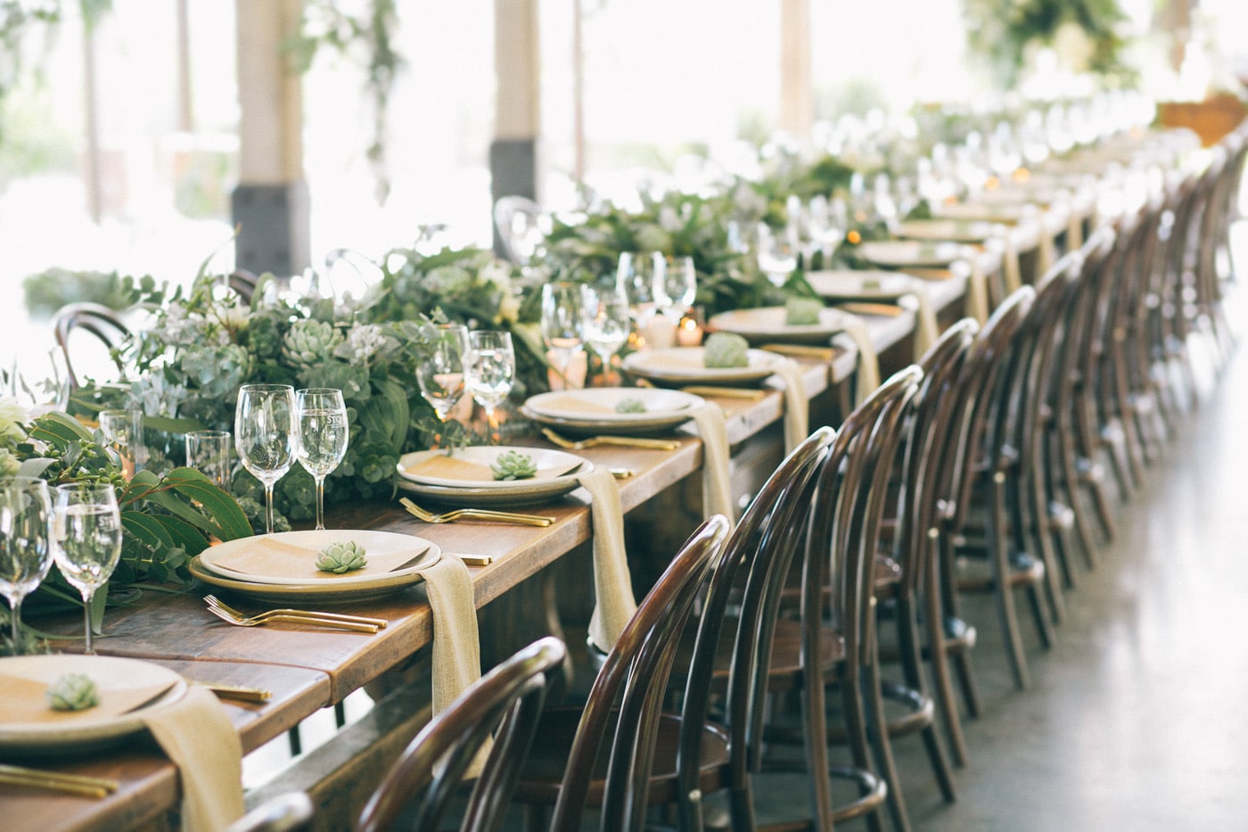a stunning wedding reception draped in greenery | design by the style co via coco kelley