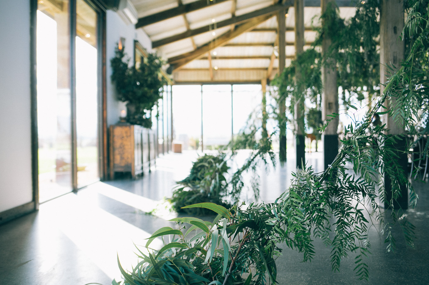a stunning wedding reception draped in greenery | design by the style co via coco kelley