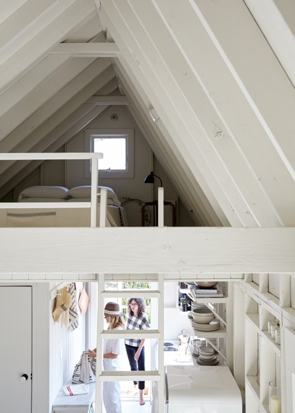 a tiny lofted bedroom in this whitewashed beach cabin house tour | via coco kelley