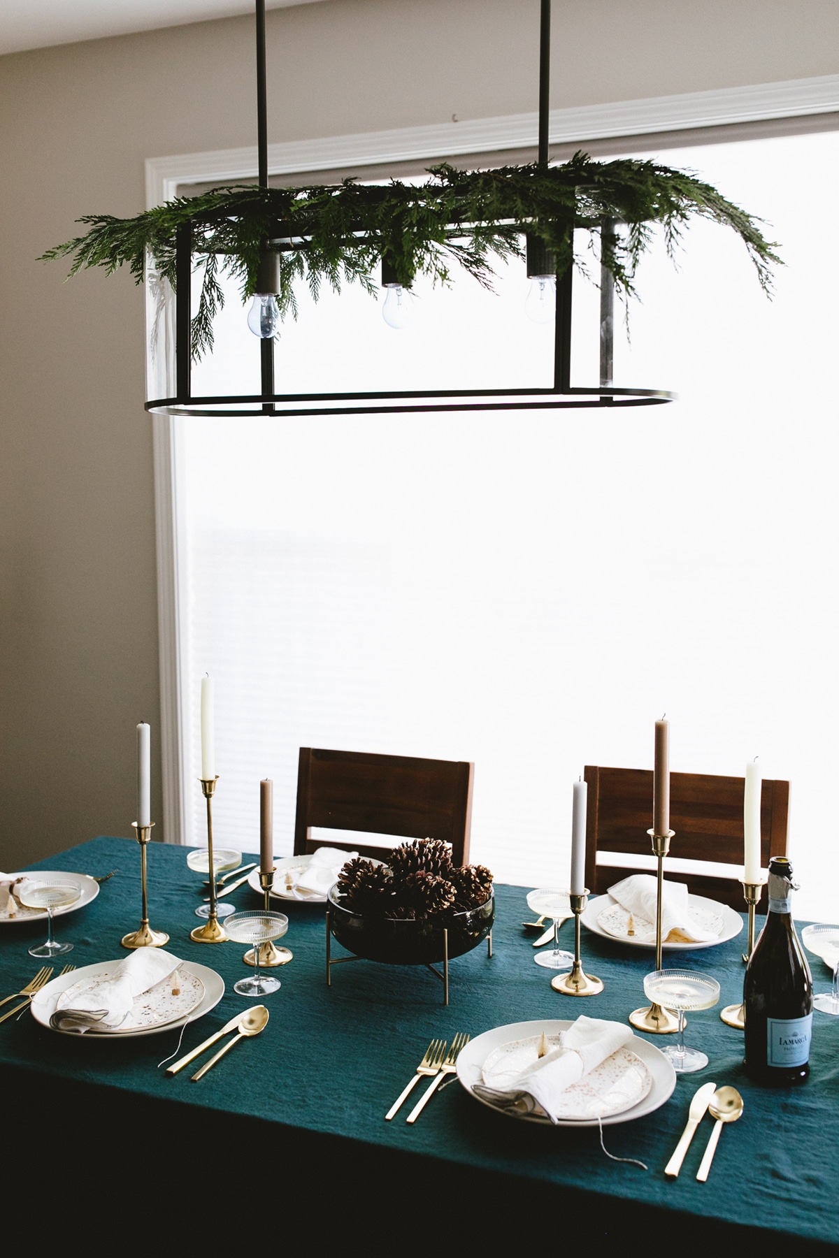 add a little swag to your chandelier to create a festive holiday look in your dining room | coco kelley