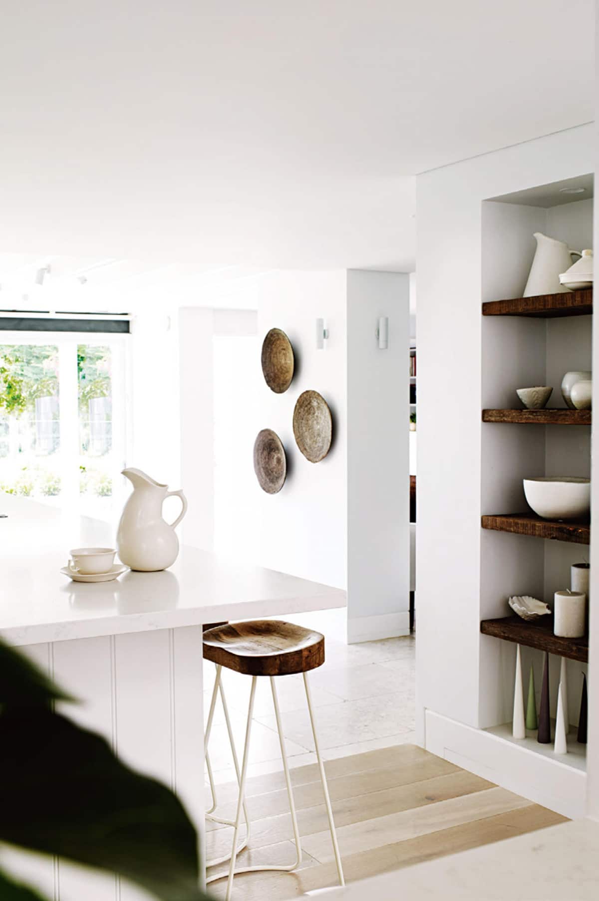 all white with doses of wood in this modern kitchen | room of the week via coco kelley