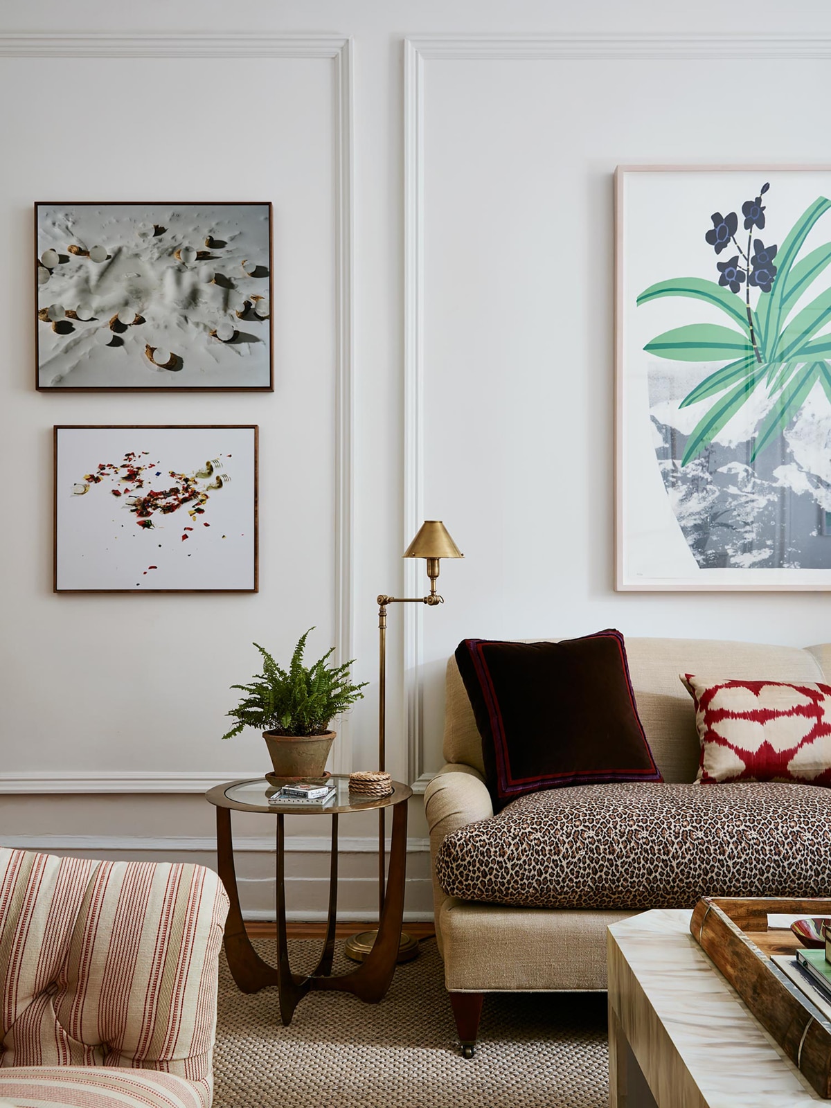 an eclectic mix of modern art and formal furnishings in this small apartment living room | room of the week via coco kelley