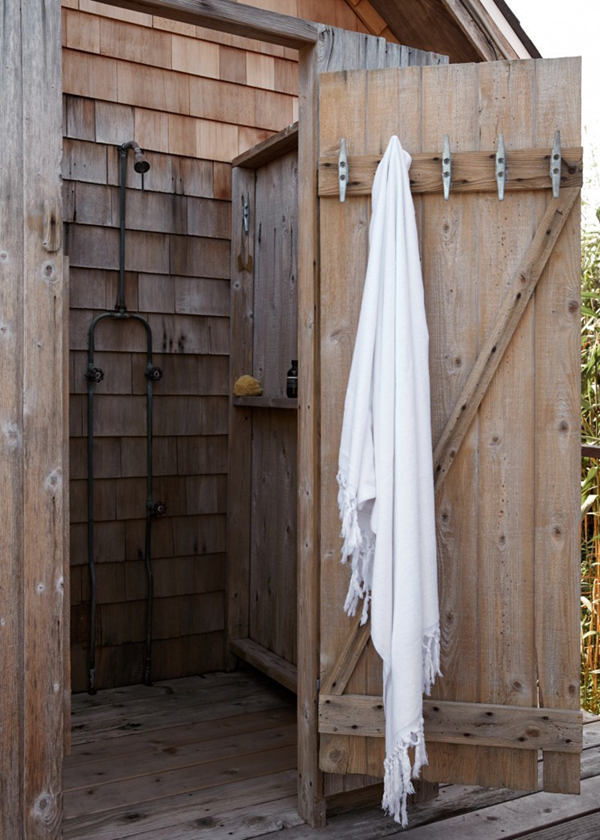 an outdoor shower for a small beach cabin on fire island | via coco kelley