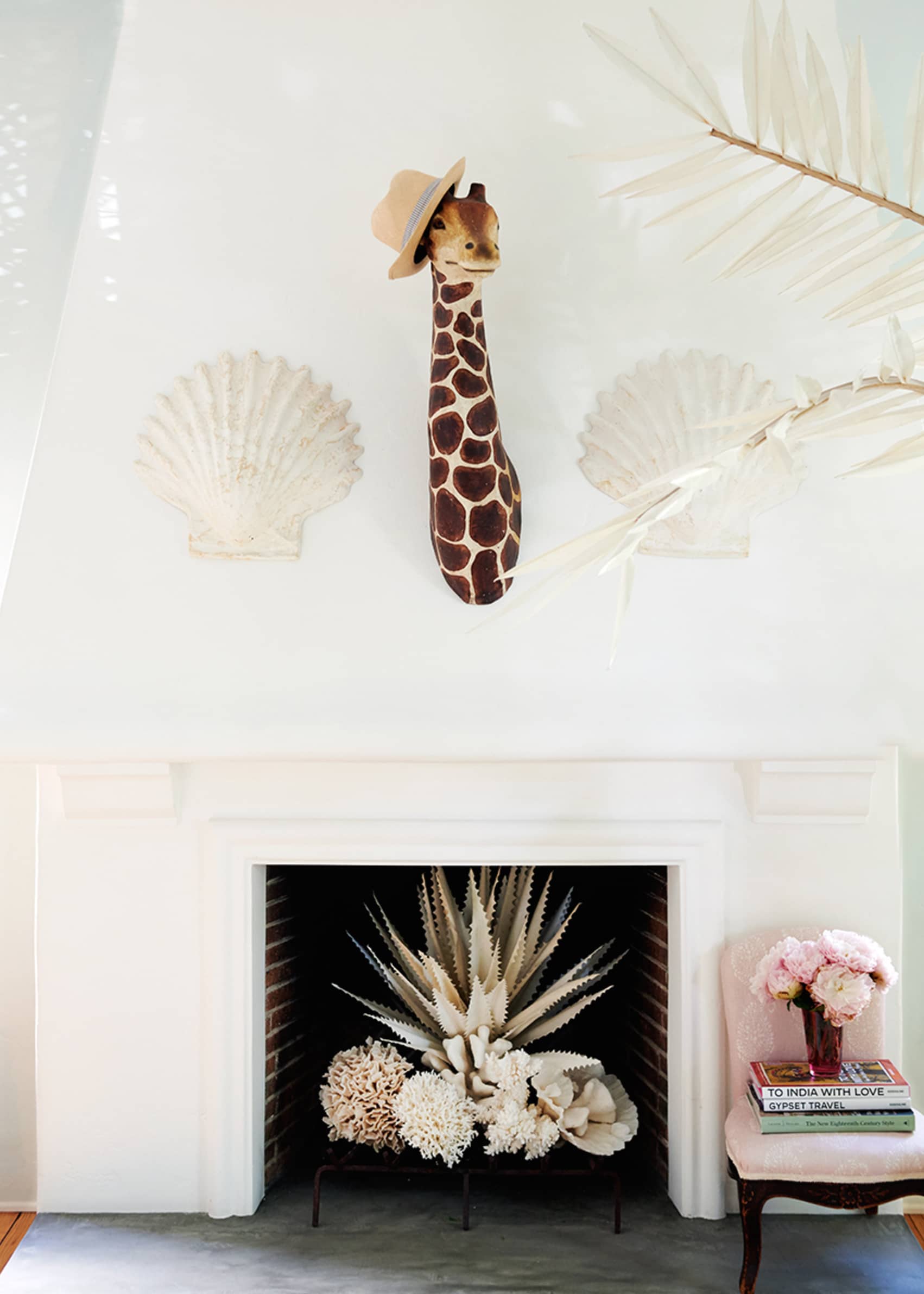 rebecca de ravenel's beach bohemian living room with a whimsical fireplace | house tour on coco kelley