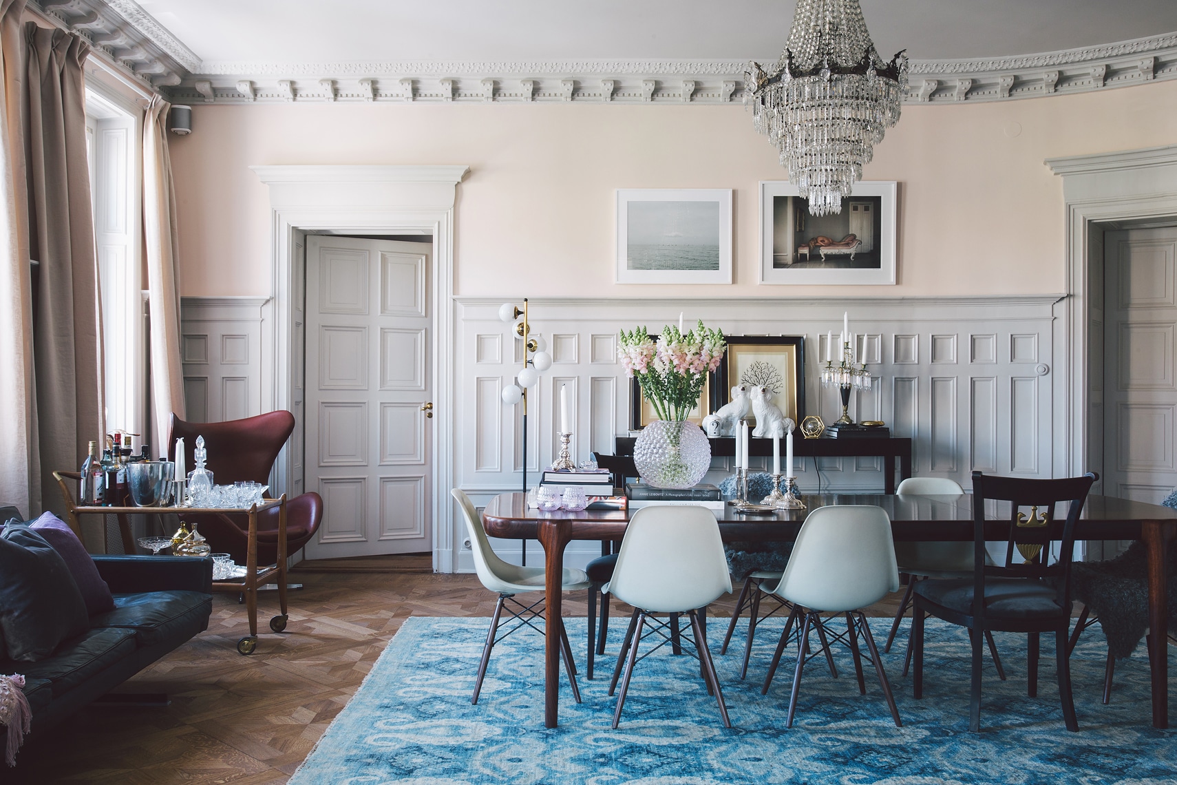 romantic dining room in pale peach and blue with gorgeous wood floors and dramatic chandelier | via coco kelley