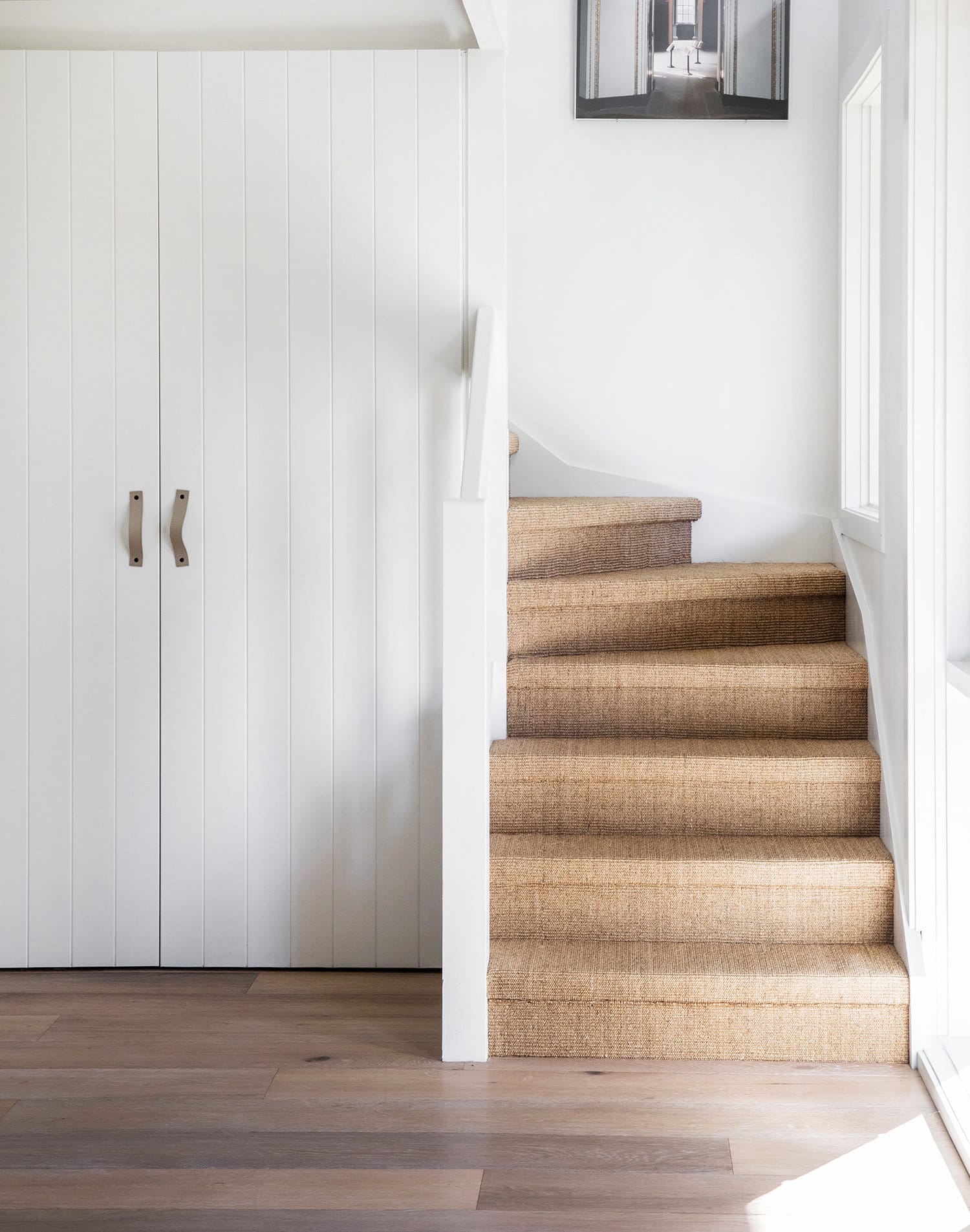 beautifully installed sisal carpet stairwell | coco kelley