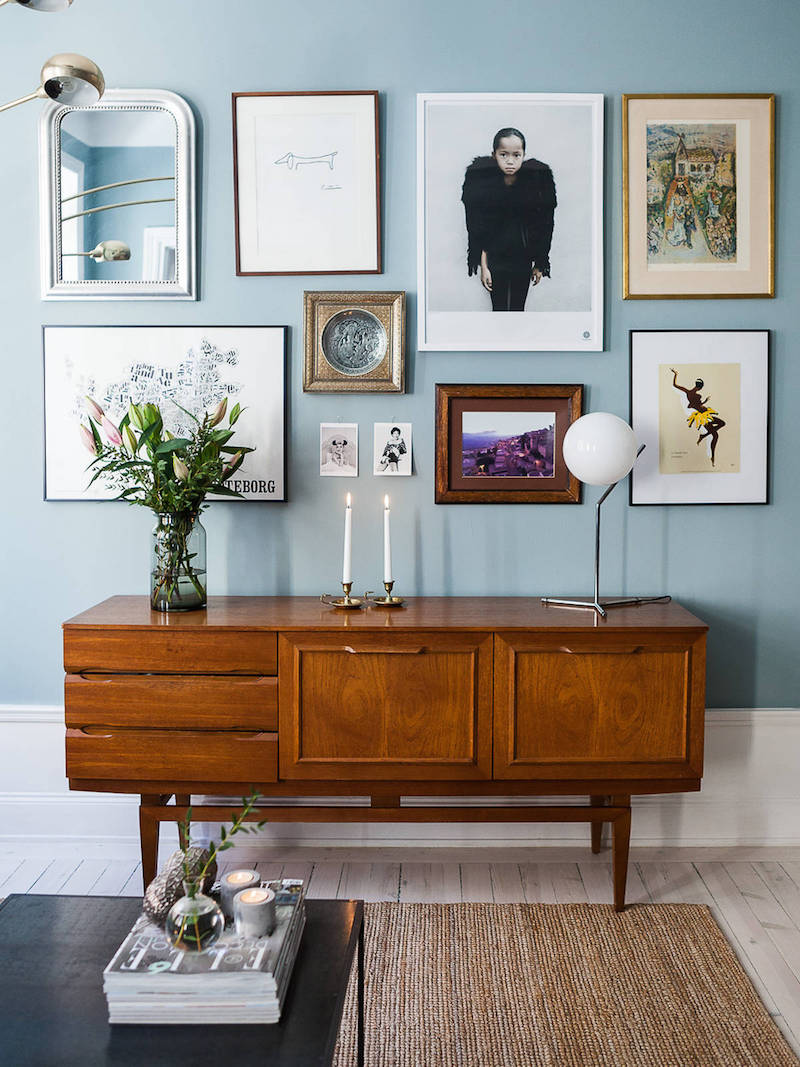 credenza and art gallery wall with mid-tone blue paint | coco kelley