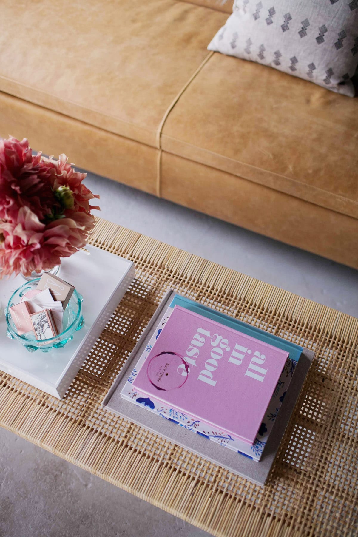 books and flowers on our studio coffee table | coco kelley