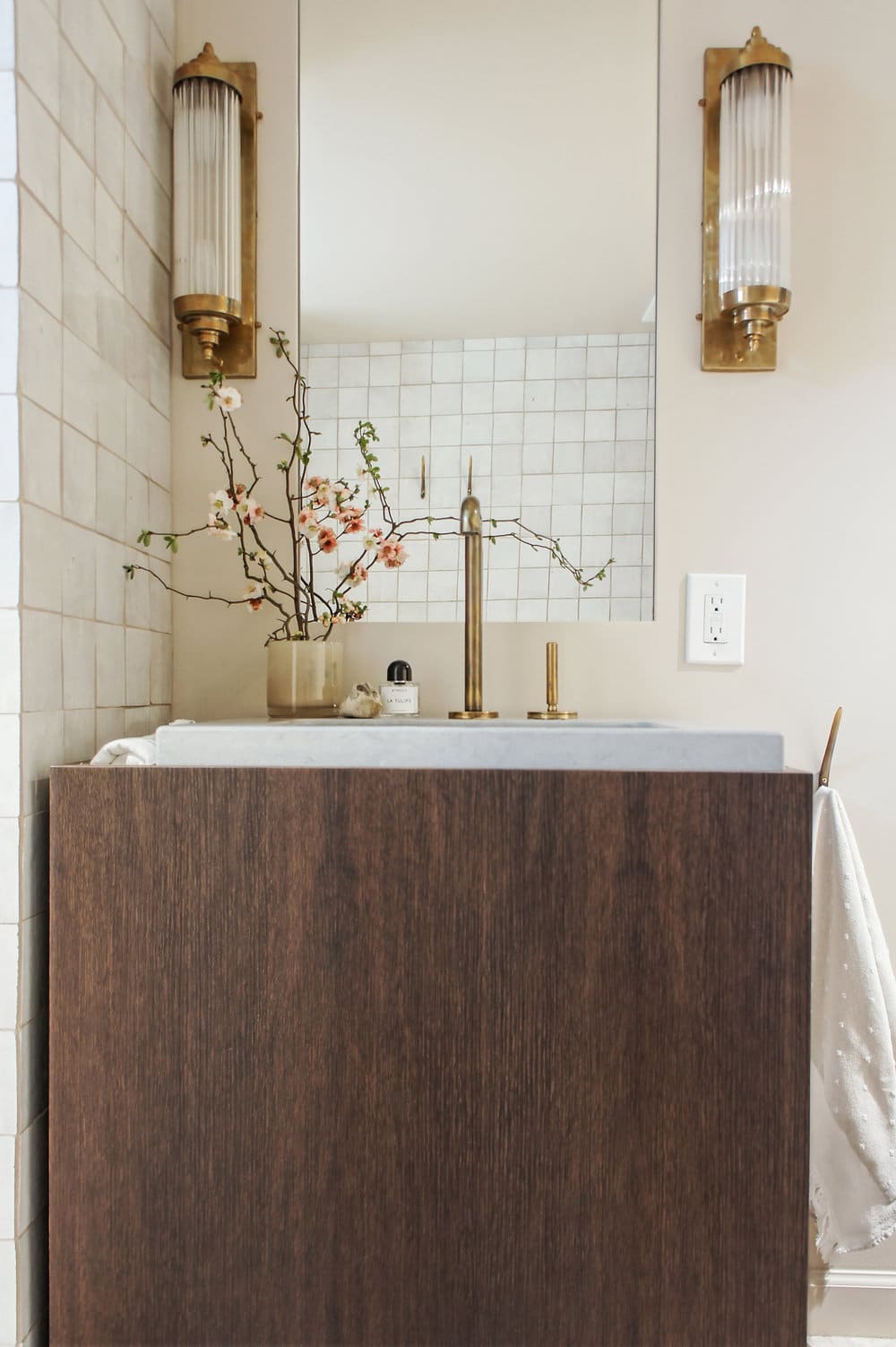 brass cream and wood tones in a small earthy bathroom remodel