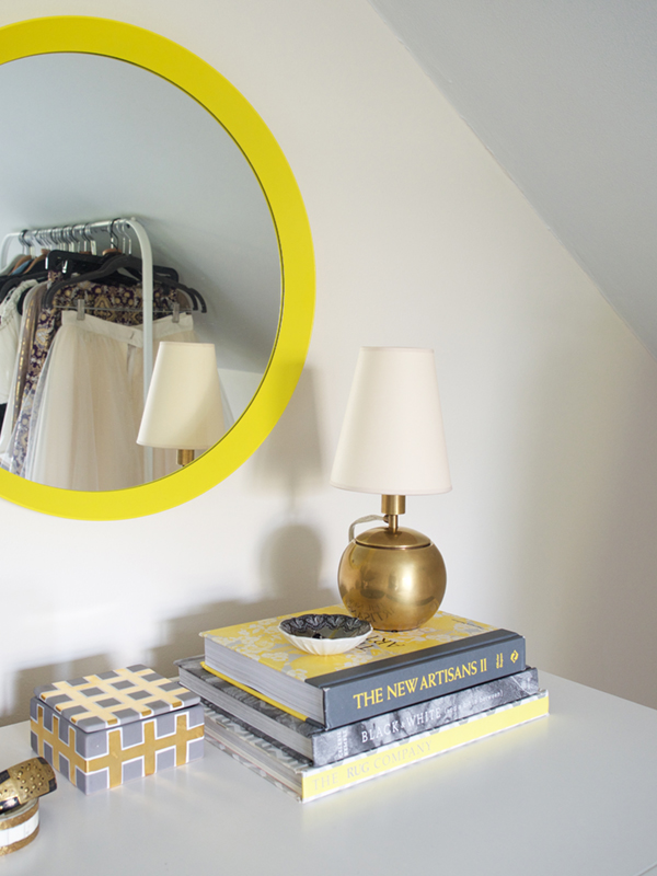 dresser styling with brass lamp books and round mirror | coco+kelley