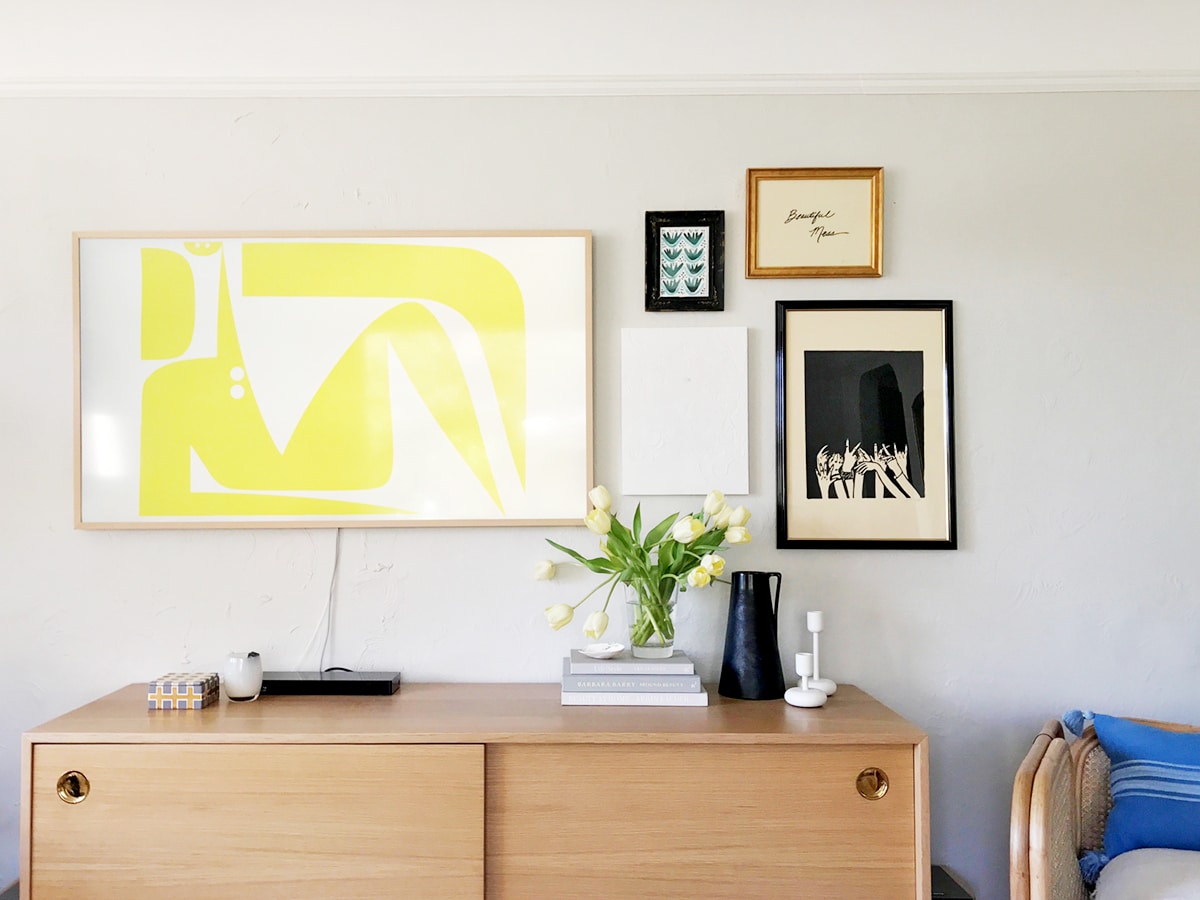 building a gallery wall around our TV and our favorite art sources | coco kelley