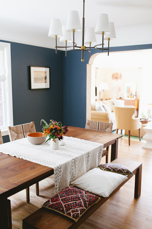 dining room with warm wood and blue walls, and textiles // coco+kelley 