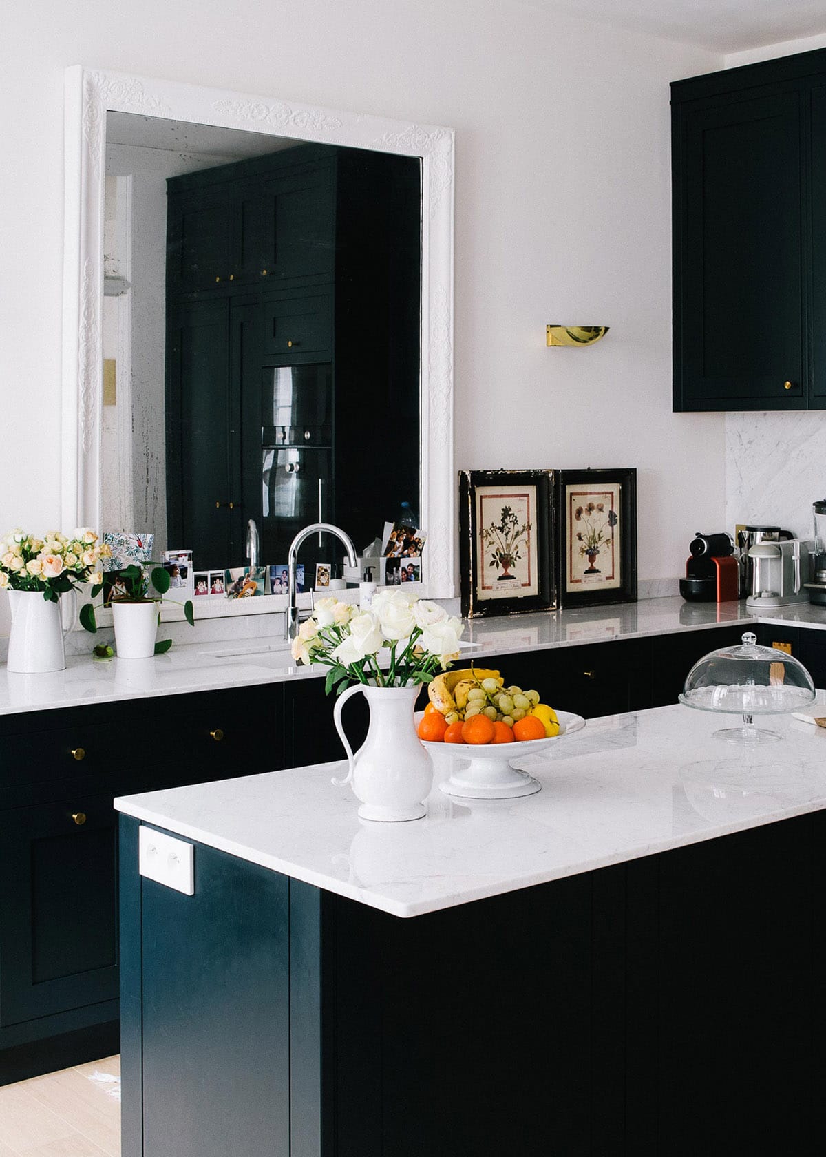 chic but casual black and white kitchen in paris | via coco kelley