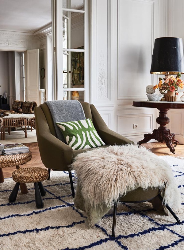 olive green modern chair and lots of layers in this vintage chic parisian house tour via coco kelley