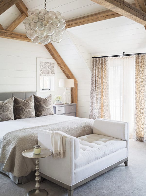 classic cottage bedroom with modern chandelier and exposed beams via coco kelley