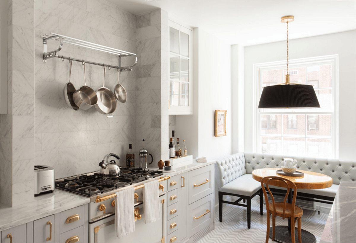 classic grey and white kitchen with brass hardware and black pendant in a gorgeous breakfast nook via coco kelley2