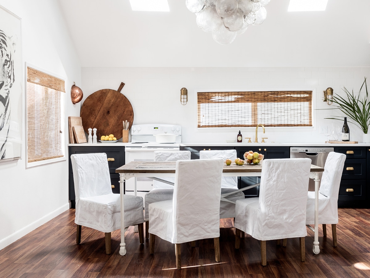 combined kitchen and dining room in this chic seaside cottage | cannon beach cottage house tour on coco kelley - design by maison luxe