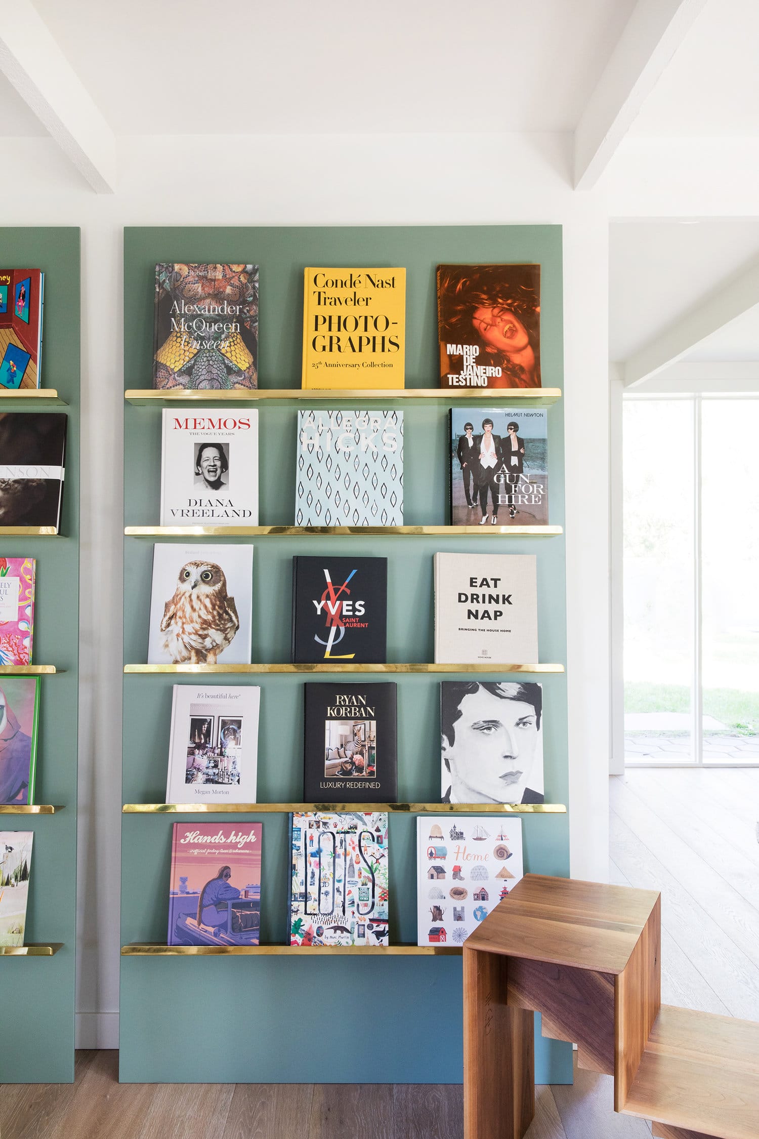cool book display shelving with brass and green | coco kelley