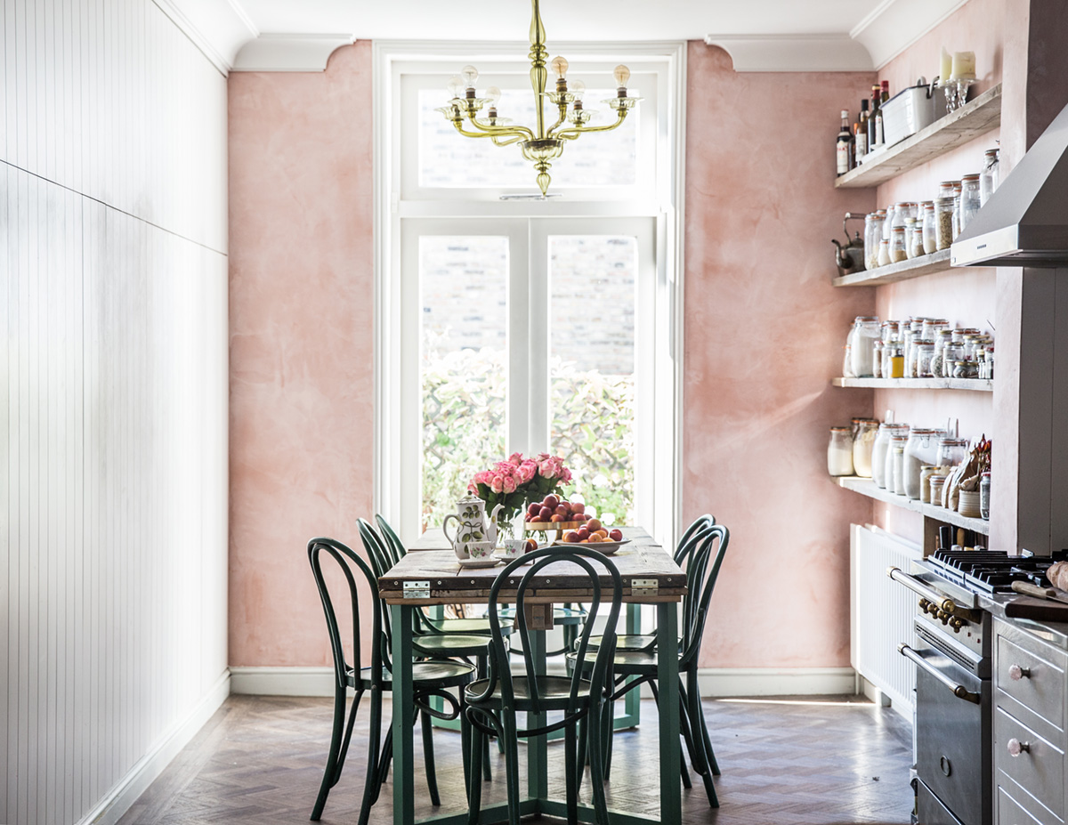 country style kitchen with pink plaster walls and green chairs from jersey ice cream co | via coco kelley