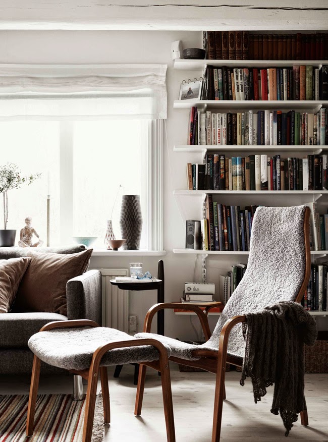 cozy shearling chair and bookshelves | coco kelley