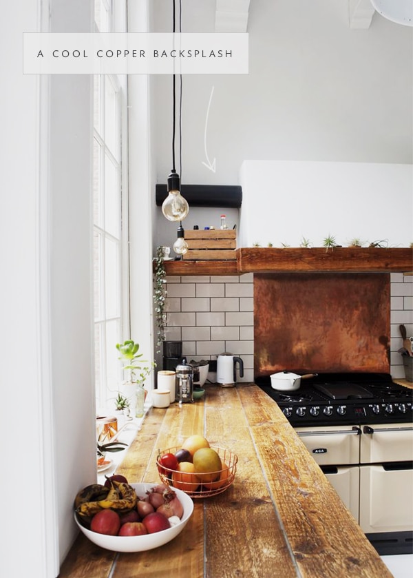 a copper backsplash bring patina and detail to this rustic kitchen | in the details via coco kelley
