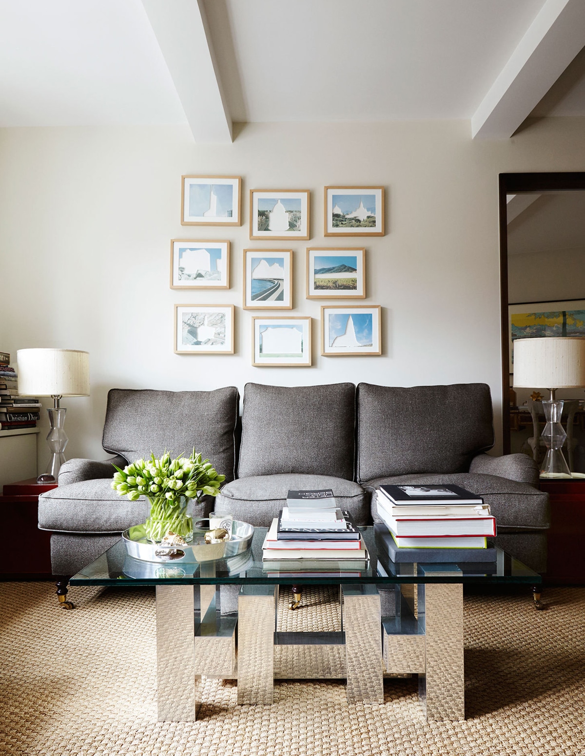 a living room vignette with quirky art and vintage chrome coffee table | room of the week via coco kelley