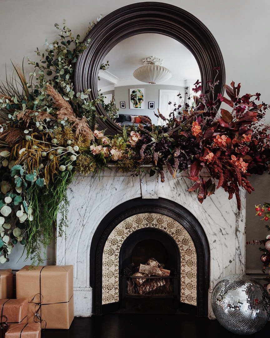 floral christmas tree and fireplace mantel installation from hello flora