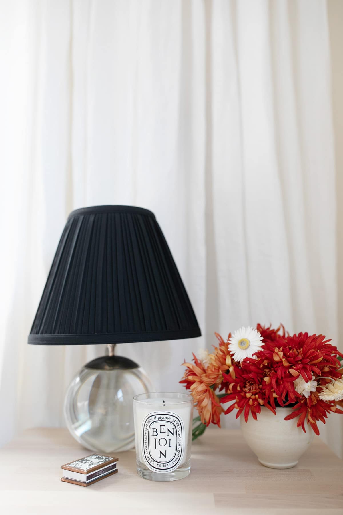 flowers and candles on the nightstand | thoughtful ways to prep your guest room for the holidays | coco kelley